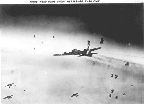 Forts from the 614th BS 301st BG fly through FLAK