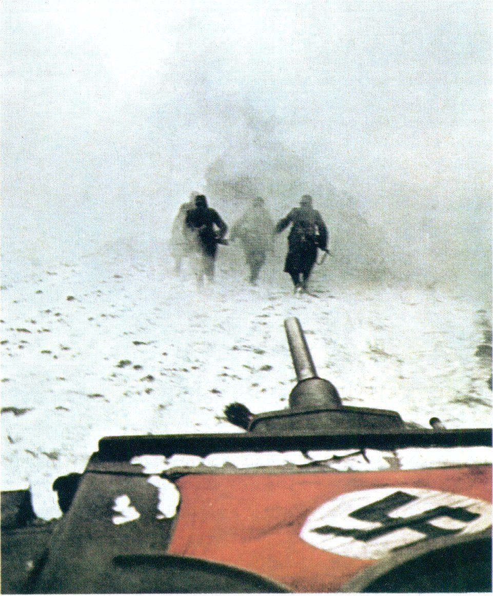 German infantry in front of a Panzer III in mid-December 1941. (The flag's