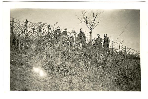 German Soldiers Above a Wire Entanglement