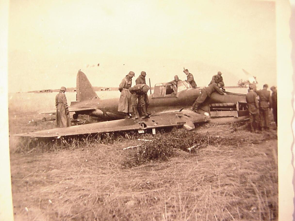 German Soldiers looking over a crashed Il2