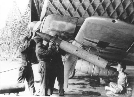 ground crew loading WGr210 rocket to the FW190a launcher