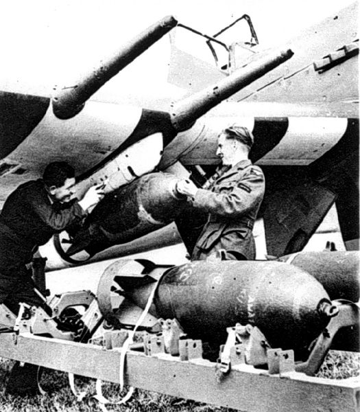 Hawker-Typhoon dive bomber loads 500-lb bombs under 20mm cannon
