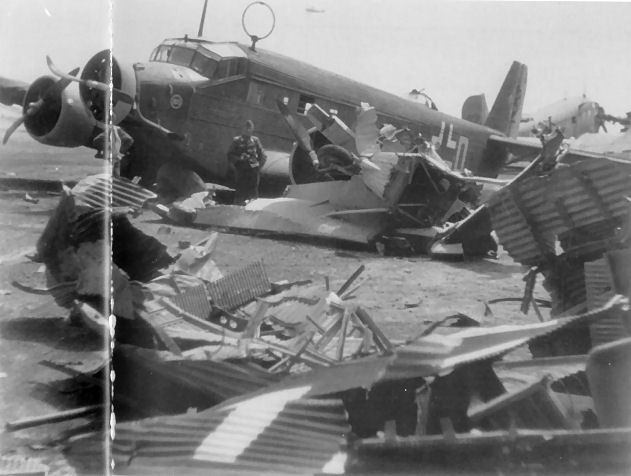 JU52 aircrew stand nonplussed amongst the wreckage on Crete