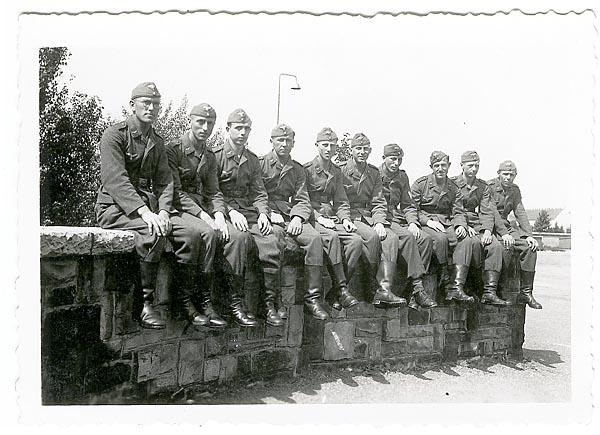 Luftwaffe airmen sitting on a wall
