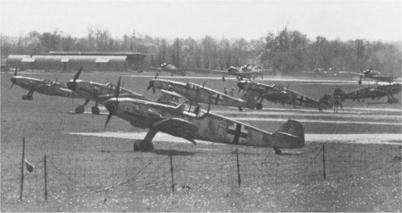 Me-109s at their base with Fw-190s in the background