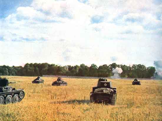 Panzers attacking enemy positions in a Polish forest.