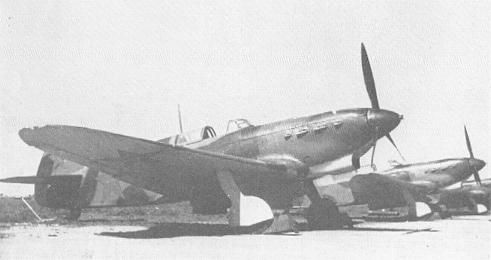 Several Yak-7B's on a soviet airfield