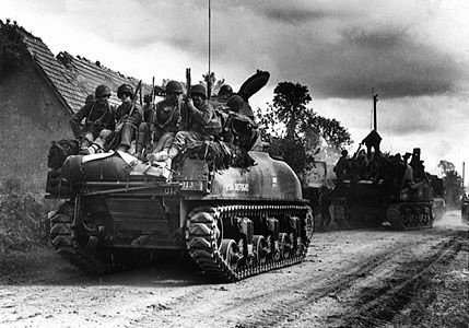 Sherman tank and troops