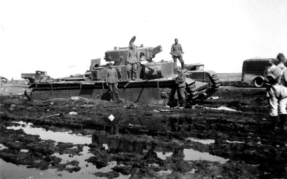 T-35 soviet heavy tank abandoned at muddy road, Russia, 1941