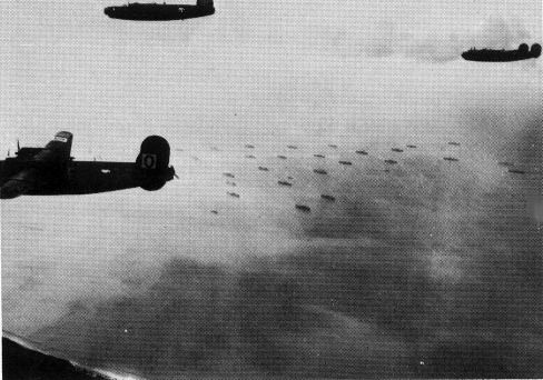 The 486th fly over the beaches of Normandy, near Caen, on June 6th, 1944.